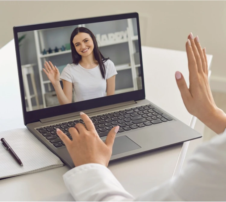 Video consultation with a healthcare professional on laptop screen