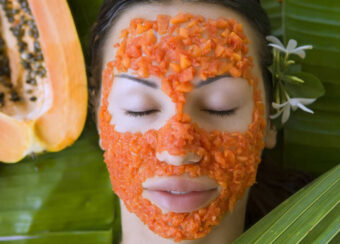 Beautiful woman having Fresh Papaya Facial Mask apply. Fresh Papaya